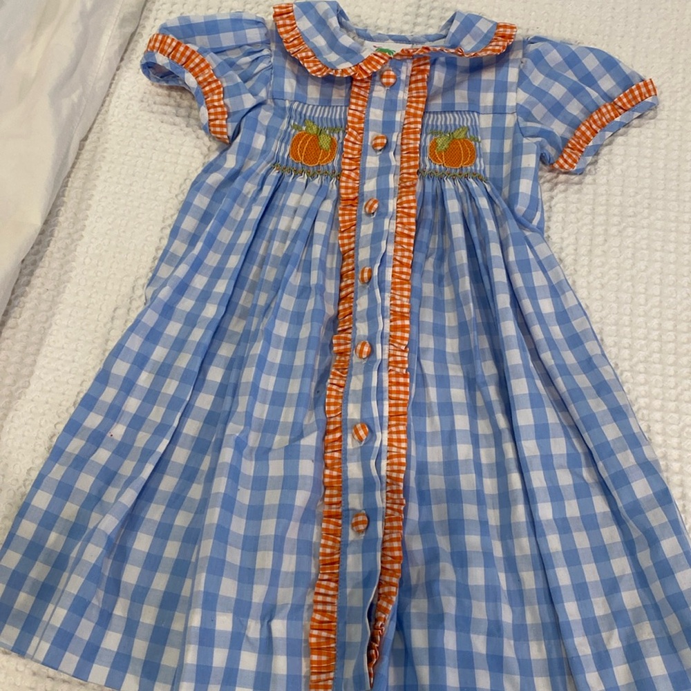 Darling smocked pumpkin dress.